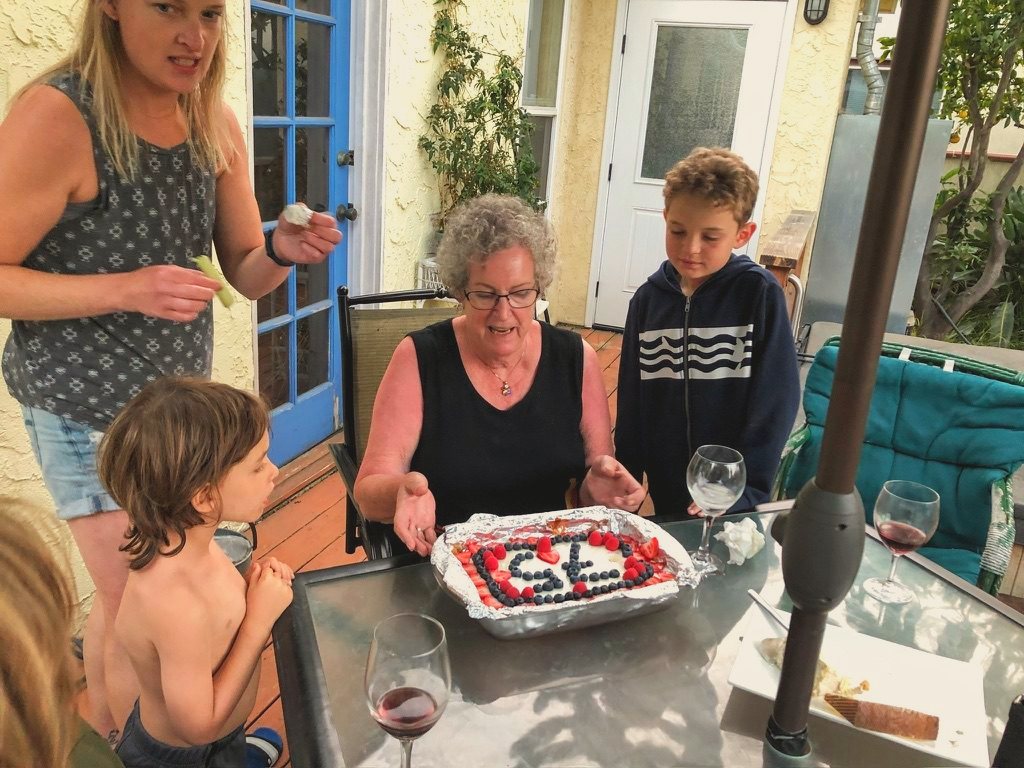 Lee, a birthday cake, and the grandchildren